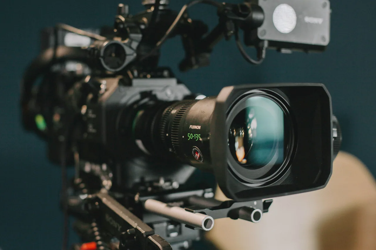Sony cinema broadcast camera with Fujinon zoom lens framed for a multi-camera capture.
